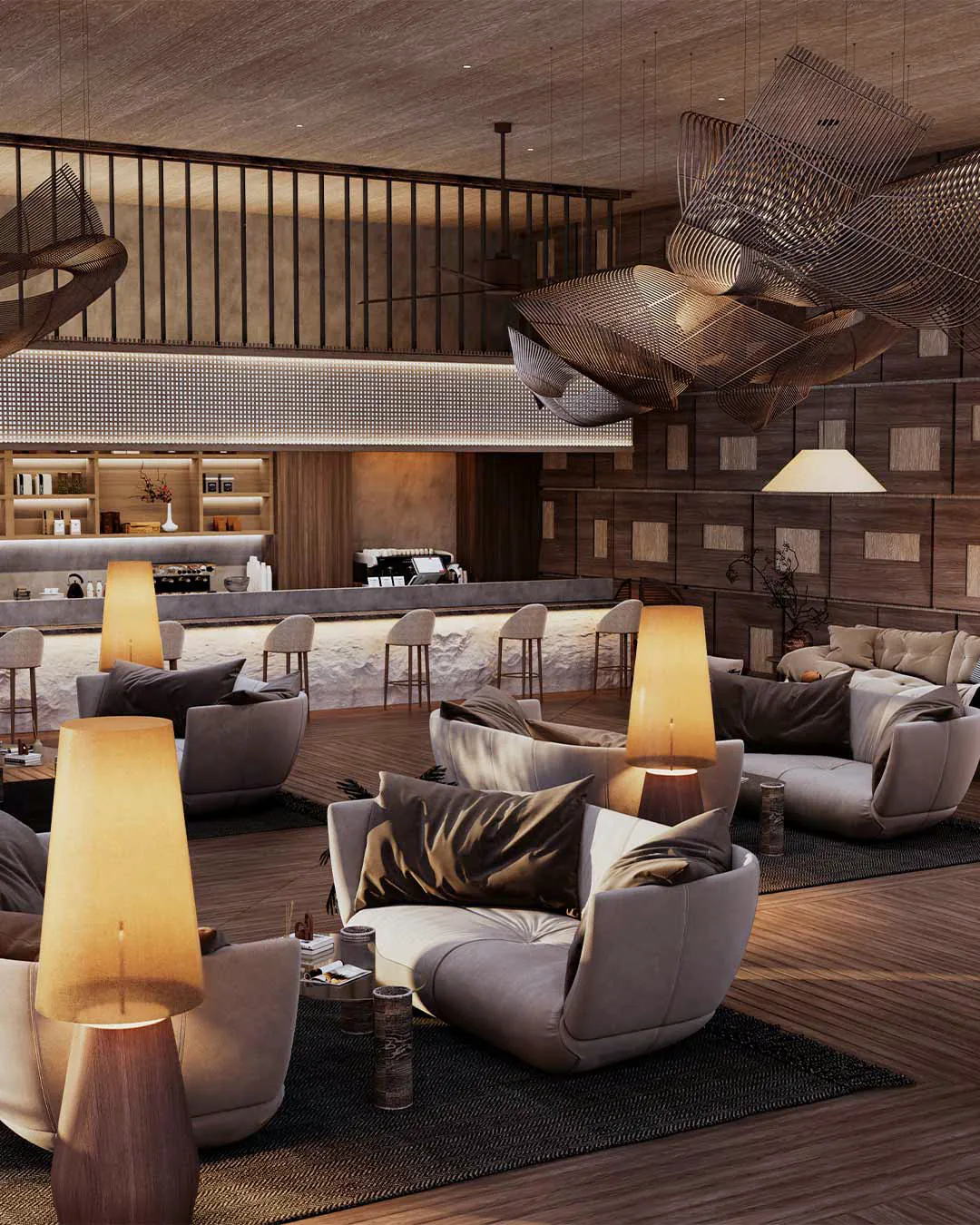 Lounge with armchairs, table lamps and a bar beneath a sculpted timber ceiling