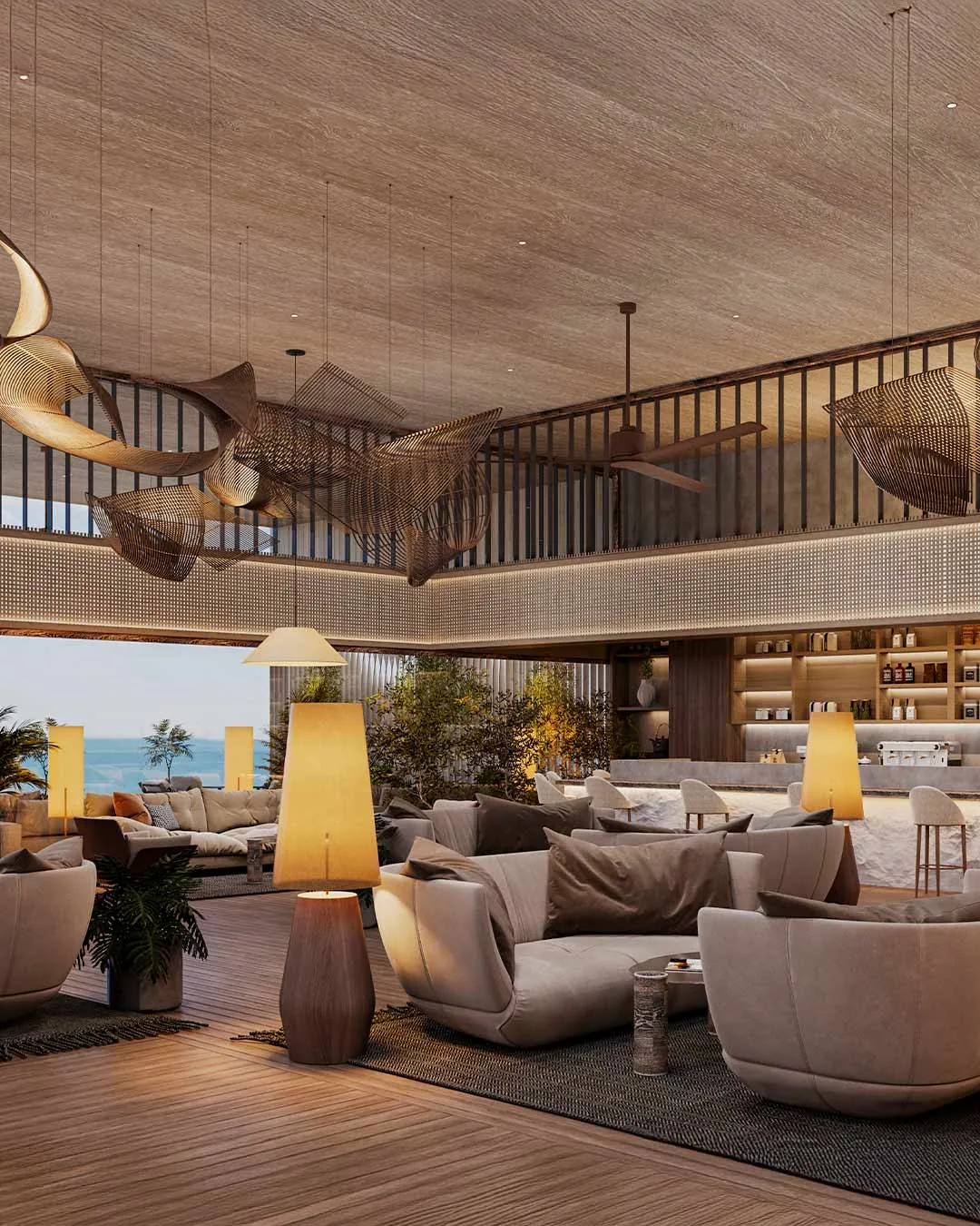 Lounge seating beneath a timber ceiling, opening onto the ocean